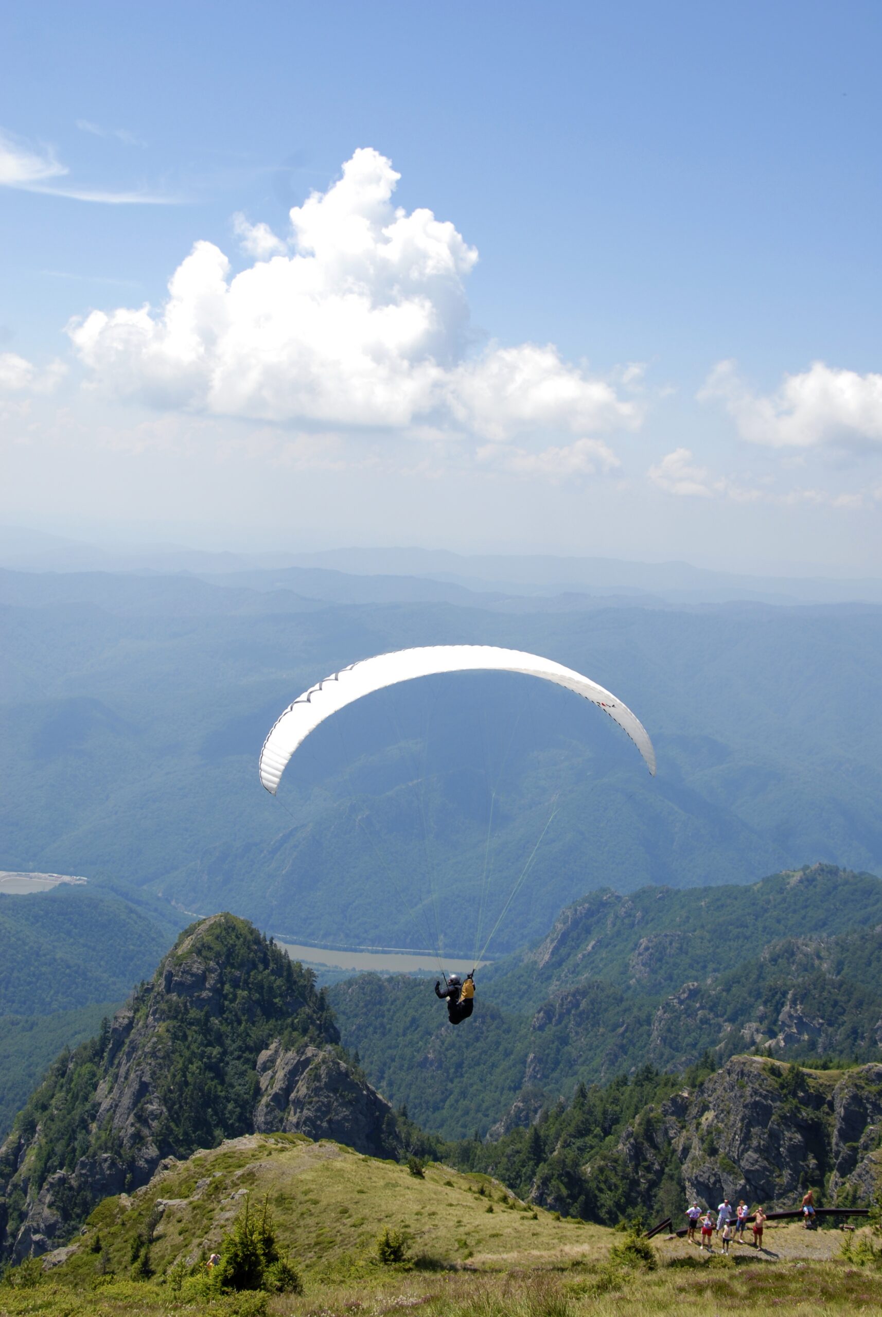 A paraglider above Cozia National Park, Romania.